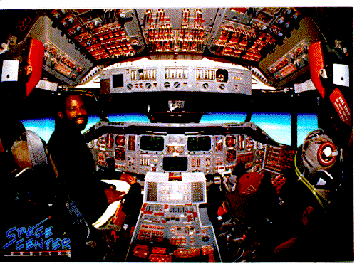 [Philip 
Emeagwali inside the Space Shuttle.]