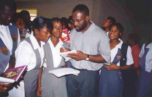 emeagwali-signing-autographs_montego-bay-jamaica-student-presentation-march-21-2001